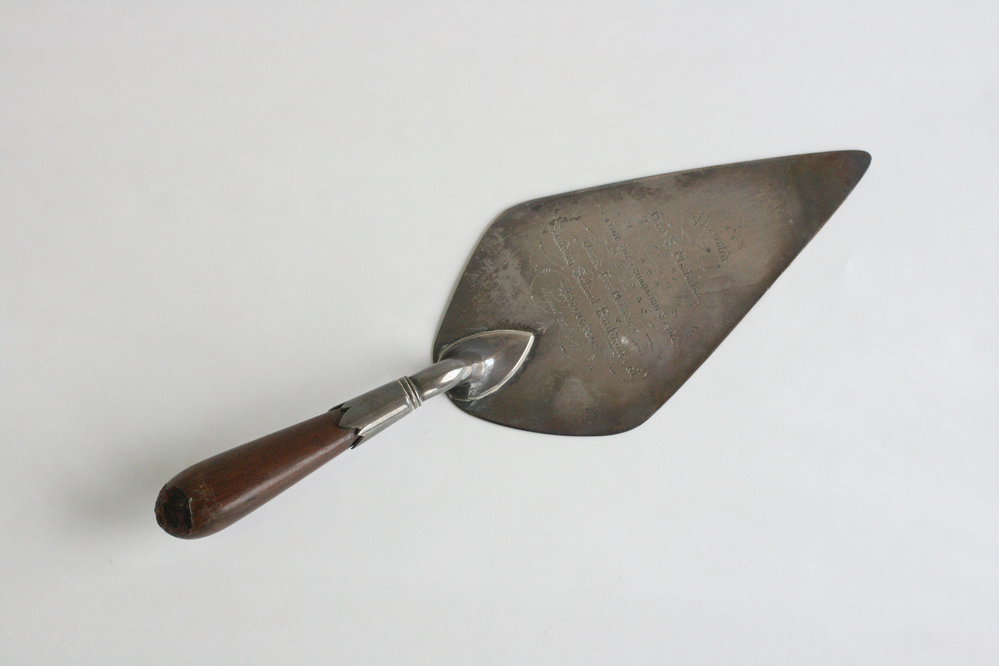 Silver trowel, with wooden handle