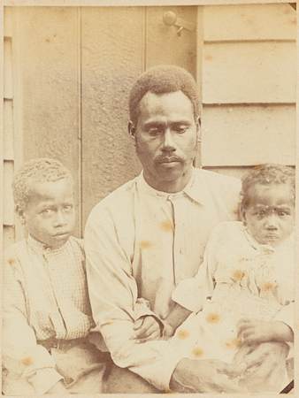 Melanesian Man with Two Children