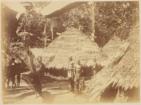 Conical thatched buildings and villagers