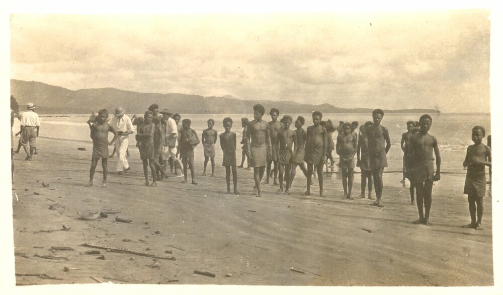 Melanesian youths on beach 