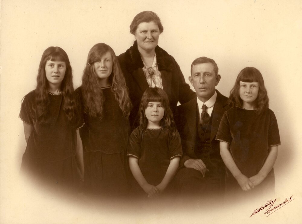 Portrait of parents with four young girls