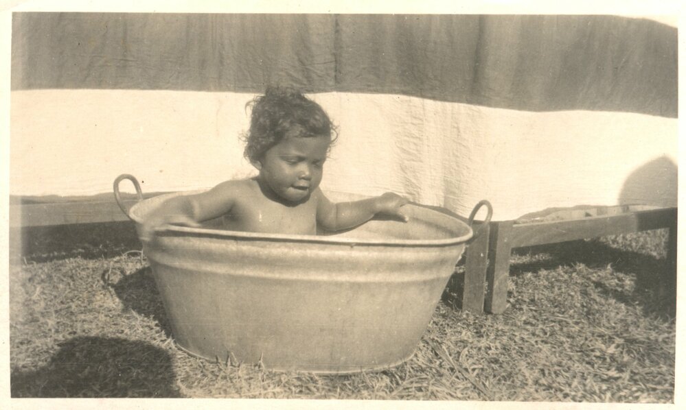 Small child in a bath tub.