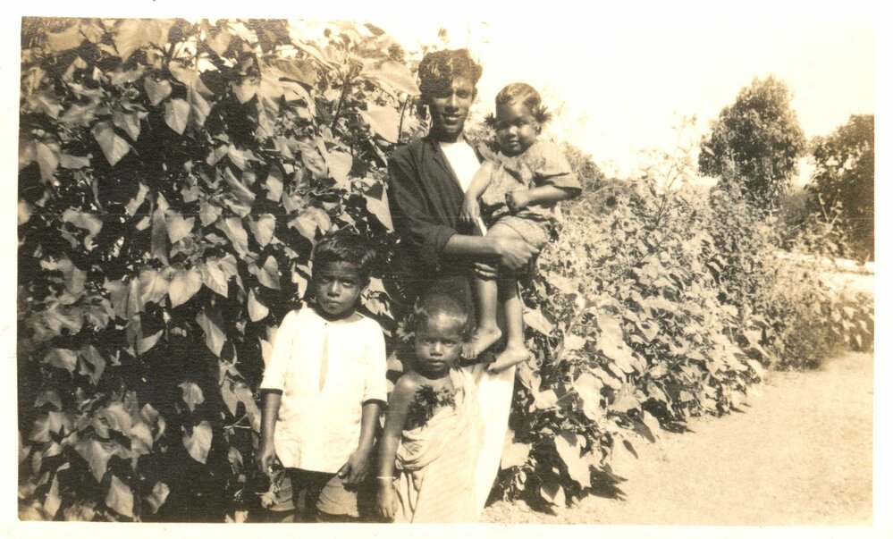 Young man with three young children. 