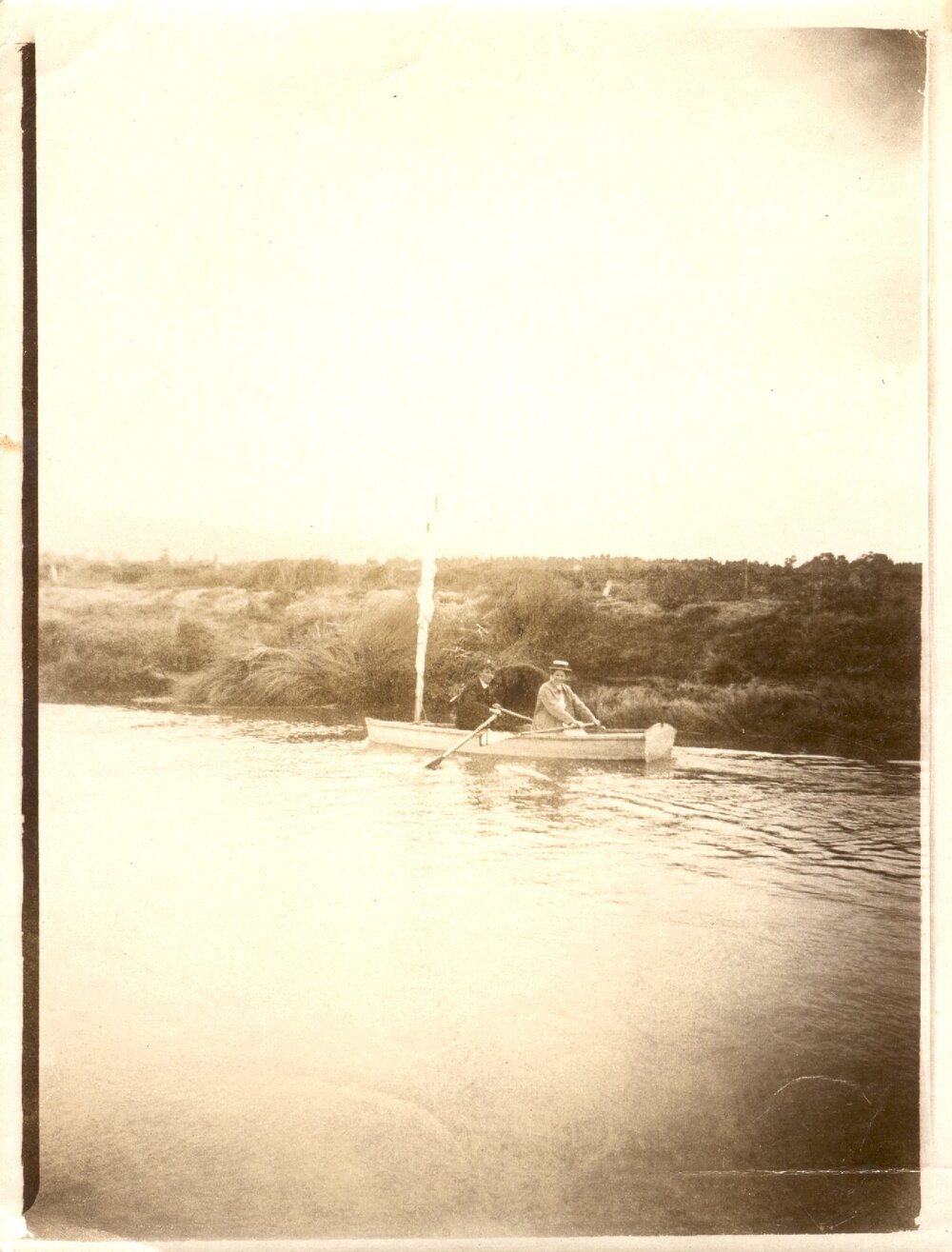 Two people in a row boat. 