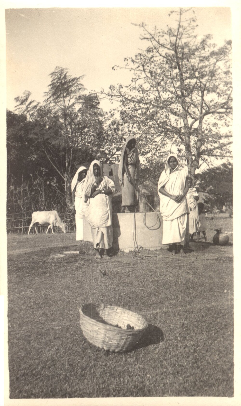 Five women at a well. 