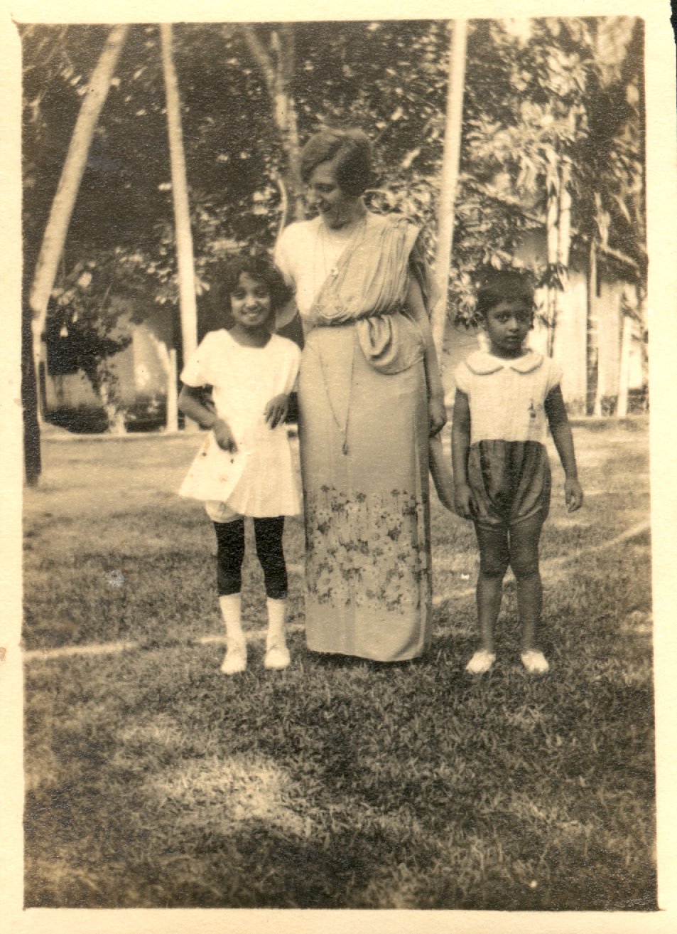 One woman with 2 Indian children. 