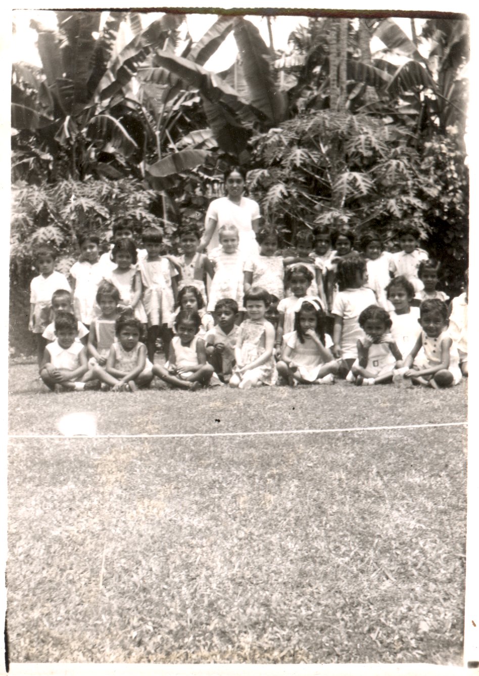 Group of children, and one young woman