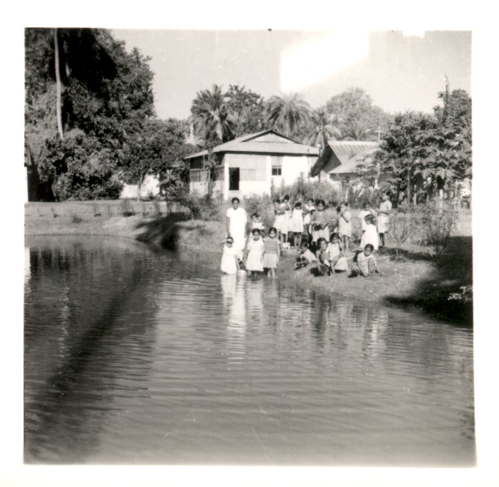 Group of people by the river. 