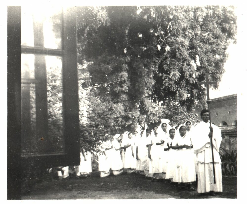 Nurses led by priest