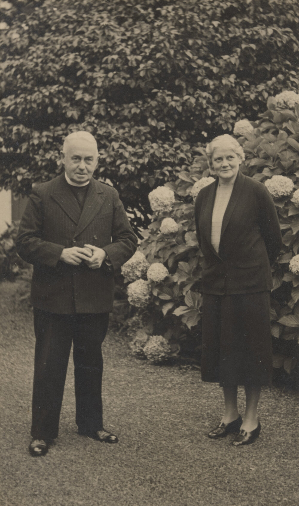 Bishop William John Simkin and wife Florence in a garden