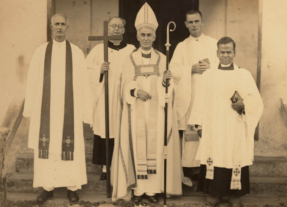 Bishop Kempthorne with a group of priests