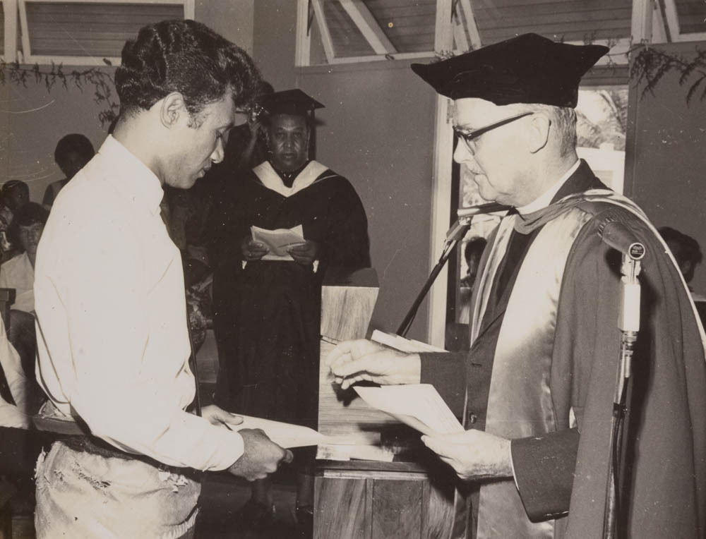 Winston Halapua being presented with a diploma