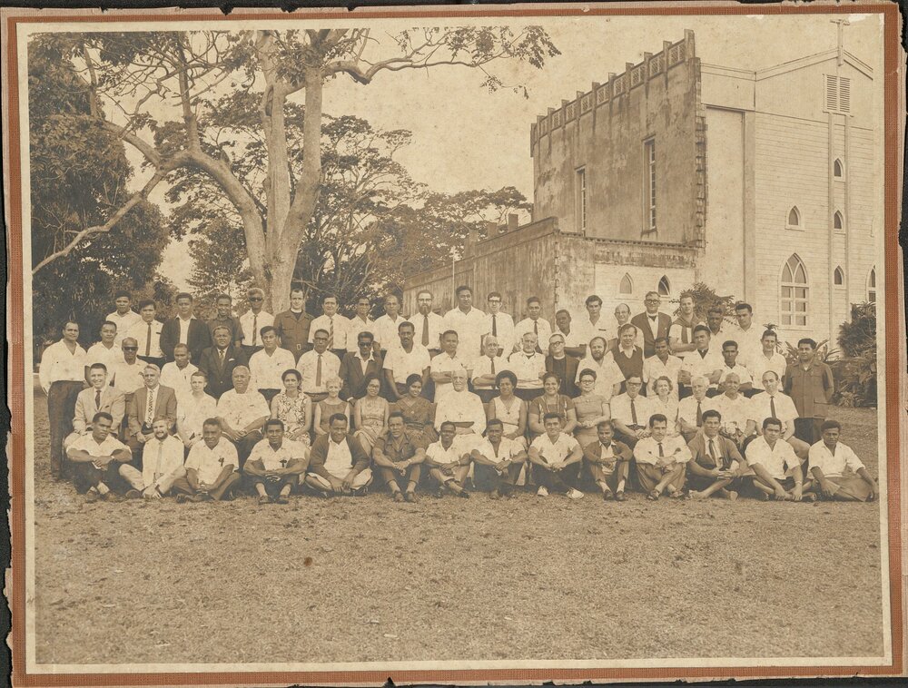 Group outside of the partially complete Holy Trinity Cathedral, Suva