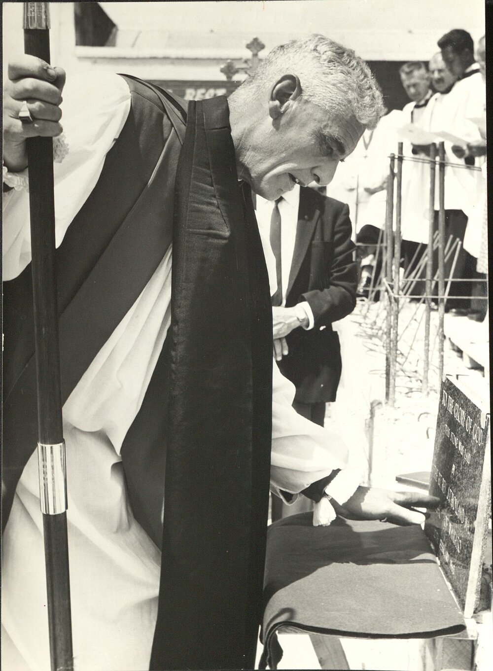Bishop John Holland, laying a stone. 