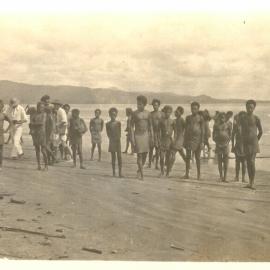 Melanesian youths on beach 