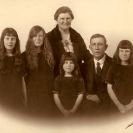 Portrait of parents with four young girls