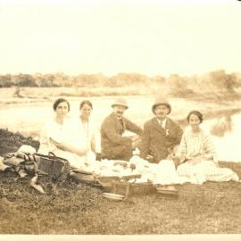 Group of European missionaries at a picnic, probably including Vivienne Opie