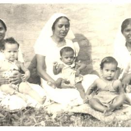 Three Indian nurses with children