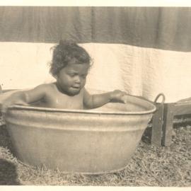 Small child in a bath tub.