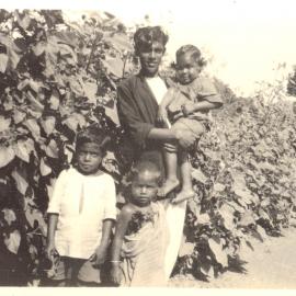 Young man with three young children. 