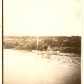 Two people in a row boat. 