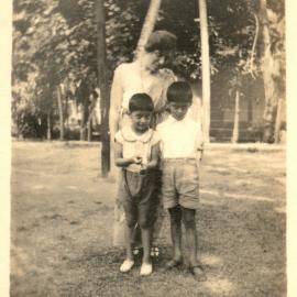 One woman with 2 Indian boys. 