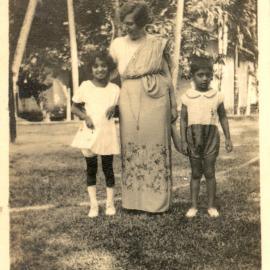 One woman with 2 Indian children. 