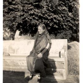 One woman on a seat. 