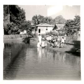 Group of people by the river. 