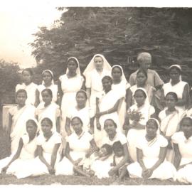 Group photograph of 22 women, 2 children