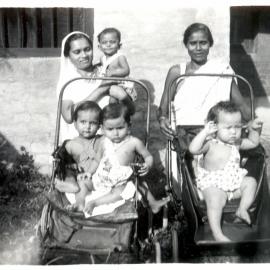 2 Indian women with 4 children