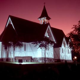 St.John's College chapel at night against a red sky