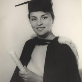 Māori woman graduate in cap and gown