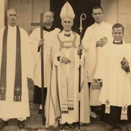 Bishop Kempthorne with a group of priests