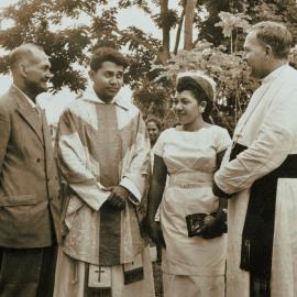 Bishop Vockler with a young priest and his parents