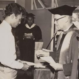 Winston Halapua being presented with a diploma