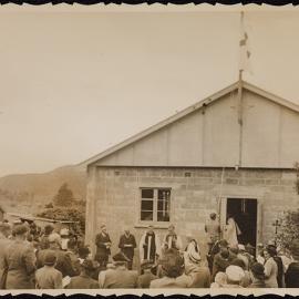 Bishop John Holland at the opening or blessing of a concrete block building