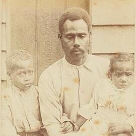 Melanesian Man with Two Children