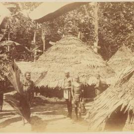 Conical thatched buildings and villagers
